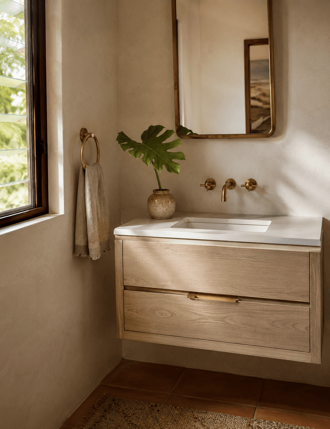 Custom floating white oak bathroom vanity with brass fixtures, Kailua, Oahu